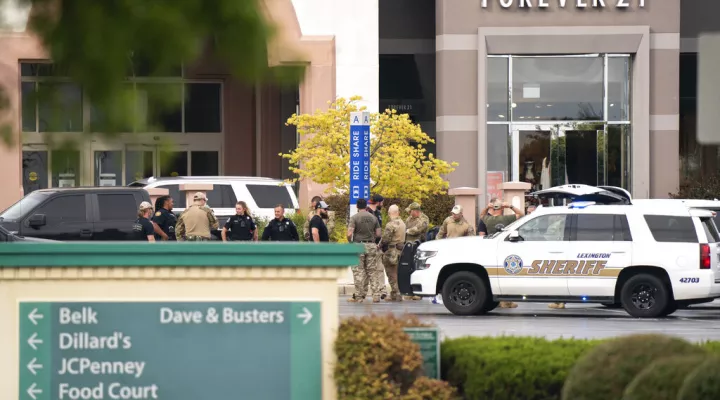 FILE - Members of law enforcement gather outside Columbiana Centre mall in Columbia, S.C., following a shooting, April 16, 2022. Authorities in South Carolina say they are investigating shooting at a club in Hampton County early Sunday, April 17, 2022 that left at least nine people injured. It was the second mass shooting in the state in as many days. (AP Photo/Sean Rayford)