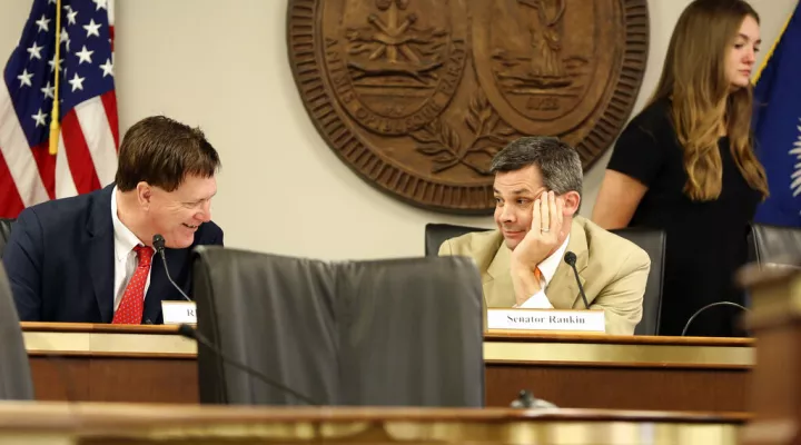 FILE - House Speaker Jay Lucas, R-Hartsville, left, talks to Senate Majority Leader Shane Massey, R-Edgefield, right, before a meeting over a Santee Cooper overhaul bill on Tuesday, June, 1, 2021, in Columbia, S.C.  The chances of having early voting in upcoming elections in South Carolina appears to be dying after the state House and governor accused the Senate of a power grab.  (AP Photo/Jeffrey Collins, File)