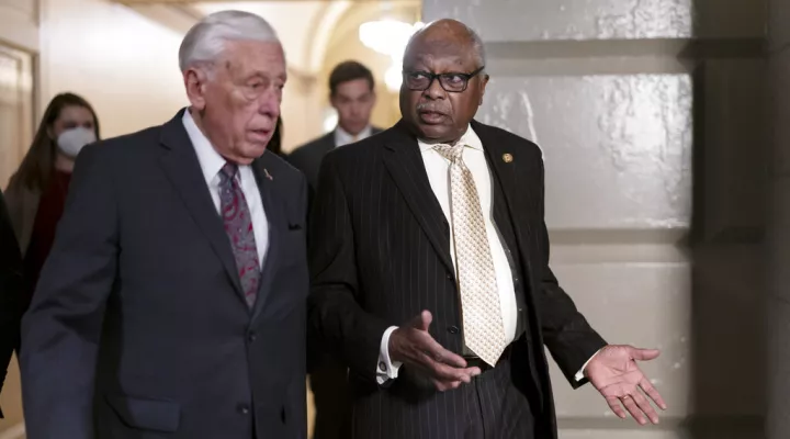 House Majority Leader Steny Hoyer, D-Md., left, and House Majority Whip James Clyburn, D-S.C., talk on their way to a House Democratic Caucus meeting, at the Capitol in Washington, Tuesday, April 5, 2022. (AP Photo/J. Scott Applewhite)
