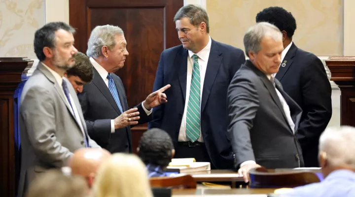State Sen. Dick Harpootlian, D-Columbia, center left, speaks to House Ways and Means Chairman Murrell Smith, R-Sumter, in the House chamber on Tuesday, May 10, 2022, in Columbia, South Carolina. (AP Photo/Jeffrey Collins)