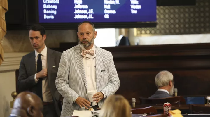 South Carolina Rep. Brian White, R-Anderson, stands near his desk on Wednesday, June 15, 2022, in Columbia, S.C. White was beaten in a Republican primary, ending a 22-year legislative career. (AP Photo/Jeffrey Collins)