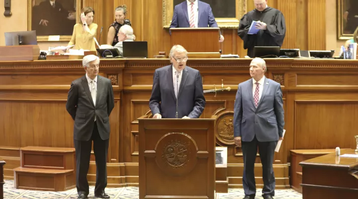 South Carolina Sen. Nikki Setzler, D-West Columbia, left, Senate Finance Committee Chairman Harvey Peeler, R-Gaffney, center, and Senate President Thomas Alexander, R-Walhalla, right, give the highlights of the compromise plan for the state's $13.8 billion budget on Wednesday, June 15, 2022, in Columbia, S.C. (AP Photo/Jeffrey Collins)