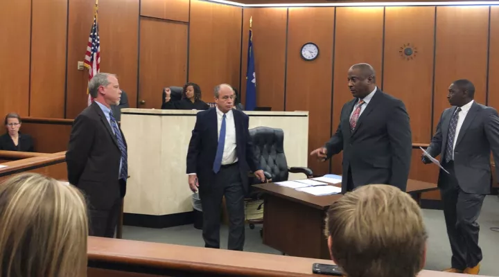 FILE - Suspended Chester County Sheriff Alex Underwood, second from right, and his lawyer, Stanley Myers, far right, walk out of the courtroom following a bond hearing after Underwood was indicted on state charges of embezzlement and misconduct in office on Jan. 9, 2020, at the Richland County Courthouse in Columbia, South Carolina. The former Chester County sheriff convicted of abuse power and other charges was sentenced Monday, July 11, 2022 to nearly 4 years in prison. (AP Photo/Jeffrey Collins, File)
