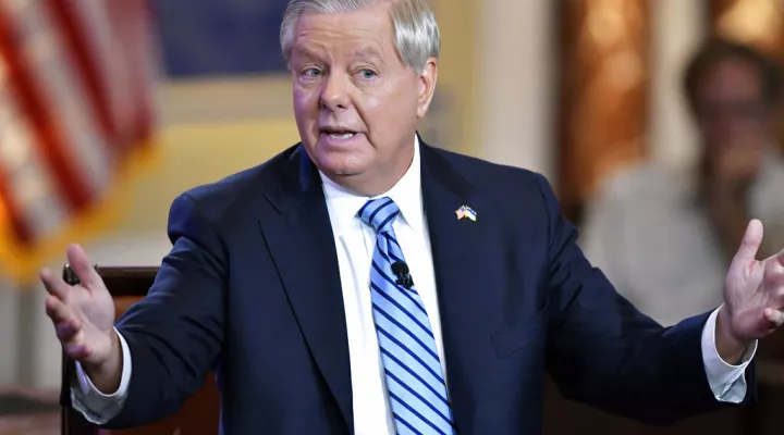 FILE - Sen. Lindsey Graham, R-S.C., speaks Monday, June 13, 2022, during a debate with Sen. Bernie Sanders, I-Vt, hosted by Fox News at the The Edward M. Kennedy Institute in Boston. The Georgia investigation into potential criminal interference in the 2020 election is heating up. Prosecutors are trying to force allies and advisers of former President Donald Trump to come to Atlanta to testify before a special grand jury. (AP Photo/Josh Reynolds, File)