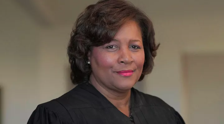 FILE - U.S. District Judge J. Michelle Childs stands in the federal courthouse where she hears cases on Feb. 18, 2022, in Columbia, S.C. On Thursday, May 26, the Senate Judiciary Committee voted 17-5 to Childs' nomination to the U.S. Court of Appeals for the District of Columbia Circuit. (AP Photo/Meg Kinnard, File)