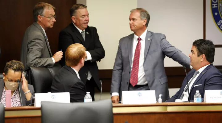 Several South Carolina House members confer during a break in a meeting of a special House committee looking at a stricter abortion law in the state on Tuesday, July 19, 2022, in Columbia, South Carolina. (AP Photo/Jeffrey Collins)