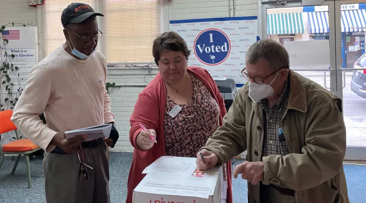  Deputy Director of Voter Registration and Elections Christina Thompson swears in Marlboro County poll managers Charles Peterkin, left, and Derek Montrose. The men will be in charge of poll security at their respective precincts' locations on Nov. 8. 
