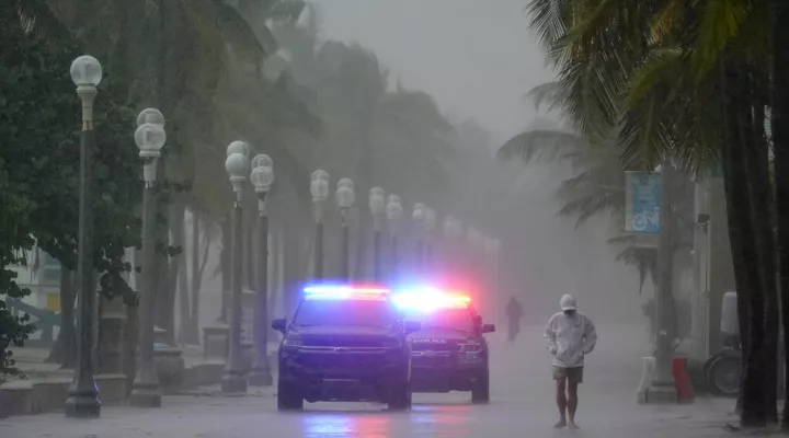 Police patrol the Hollywood Beach Broadwalk as conditions deteriorate with the approach of Hurricane Nicole, Wednesday, Nov. 9, 2022, in Hollywood Beach in Hollywood, Fla. (AP Photo/Wilfredo Lee)