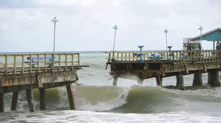 Part of Anglin's Fishing Pier is shown after it collapsed into the ocean after Hurricane Nicole arrived, Thursday, Nov. 10, 2022, in Lauderdale-by-the-Sea, Fla. Tropical Storm Nicole made landfall as a hurricane early Thursday near Vero Beach, Fla. It's such a sprawling storm that it has covered nearly the entire peninsula while reaching into Georgia and South Carolina. (AP Photo/Wilfredo Lee)