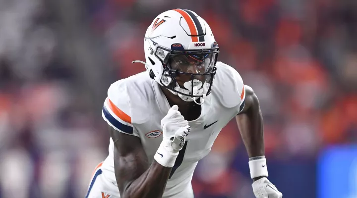 Virginia wide receiver Lavel Davis Jr. runs on the field during the second half of an NCAA college football game against Syracuse on Friday, Sept. 23, 2022 in Syracuse, N.Y. Davis was one of three Virginia football players killed in a shooting, Sunday, Nov. 13, 2022, in Charlottesville, Va., while returning from a class trip to see a play. (AP Photo/Adrian Kraus)