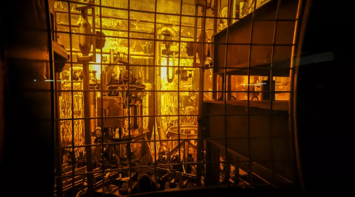 FILE - In this Nov. 20, 2013 file photo, seen through thick protective glass, shows the area where workers sand-blast the large stainless steel tanks used in the vitrification process to rid them of contaminants at the Defense Waste Processing Facility at the Savannah River Site near Aiken, S.C. The U.S. agency in charge of jumpstarting the production of key components for the nation's nuclear arsenal is falling short when it comes to having a comprehensive schedule for the multibillion-dollar project. The…