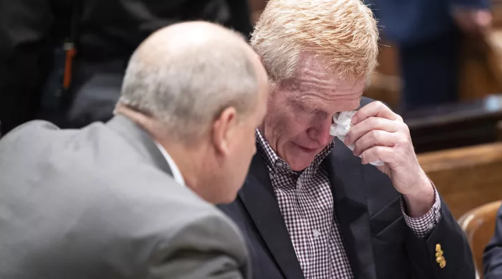 Attorney Jim Griffin speaks with Alex Murdaugh tears up after the jury was excused and the defense and prosecution teams discuss how to handle sensitive crime scene photos during his double murder trial at the Colleton County Courthouse in Walterboro, S.C, Wednesday, Jan. 25, 2023. (Joshua Boucher/The State via AP)