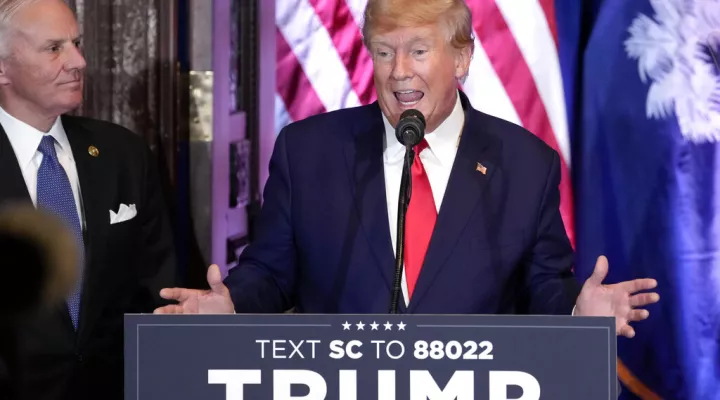 Former President Donald Trump speaks at a campaign event at the South Carolina Statehouse, Saturday, Jan. 28, 2023, in Columbia, S.C. South Carolina Gov. Henry McMaster, listens at left. (AP Photo/Alex Brandon)