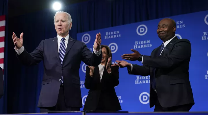 President Joe Biden and Vice President Kamala Harris stand on stage with DNC chair Jaime Harrison at the Democratic National Committee winter meeting, Friday, Feb. 3, 2023, in Philadelphia. (AP Photo/Patrick Semansky)