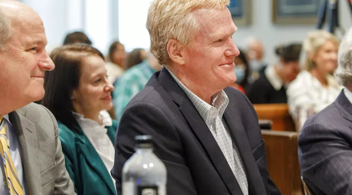 Alex Murdaugh smiles at parts of the testimony of Roger Dale Davis, who took care of the dogs at Murdaugh's home, during his double murder trial at the Colleton County Courthouse on Tuesday, Feb. 14, 2023, in Walterboro, S.C. The 54-year-old attorney is standing trial on two counts of murder in the shootings of his wife, Maggie and son Paul, at their Colleton County home and hunting lodge on June 7, 2021. (Grace Beahm Alford/The Post And Courier via AP, Pool)