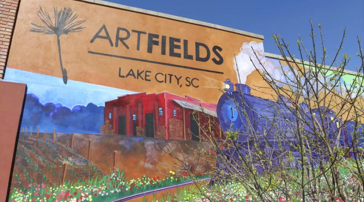 A mural adorns a facade, Tuesday, March 7, 2023, in Lake City, S.C. The four Americans violently kidnapped last week in Mexico had ties to the small town in South Carolina. (AP Photo/James Pollard)