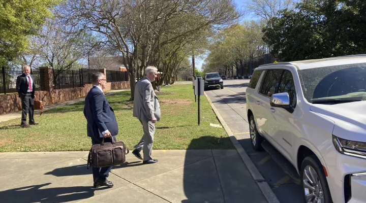 Former SCANA COO Stephen Byrne, center, walks out of federal court after being sentenced to 15 months in prison for his role in lying about the construction progress of a pair of nuclear reactors in South Carolina that were never finished, costing ratepayers and shareholders billions of dollars on Wednesday, March 8, 2023, in Columbia, S.C. (AP Photo / Jeffrey Collins)