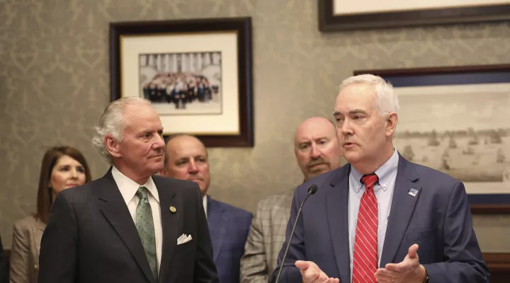 South Carolina Gov. Henry McMaster, left, listens as his nominee to run the South Carolina Department of Employment and Workforce, William Floyd, right, speaks to reporters on Thursday, March 9, 2023, in Columbia, S.C. (AP Photo/Jeffrey Collins)