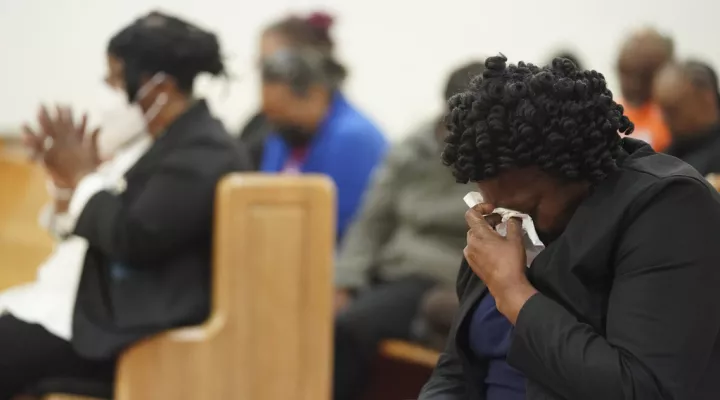 Elder Sharon Hammond uses a tissue during a vigil for a group of Americans recently kidnapped in Mexico, at Word of God Ministries in Scranton, S.C., Wednesday, March 8, 2023. Two of the four Americans, all from South Carolina, were killed after being caught in a deadly shootout while traveling last week to Matamoros for one of them to get cosmetic surgery. (AP Photo/Sean Rayford)