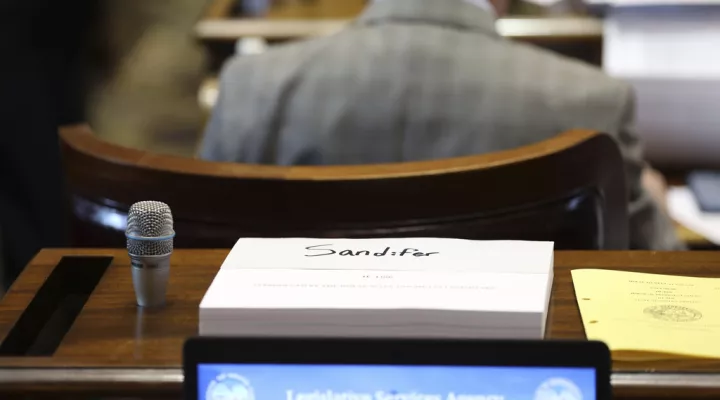 A copy of the South Carolina 2023-24 budget sits on the desk of Rep. Bill Sandifer, R-Seneca, on Tuesday, March 14, 2023, in Columbia, South Carolina. (AP Photo/Jeffrey Collins)