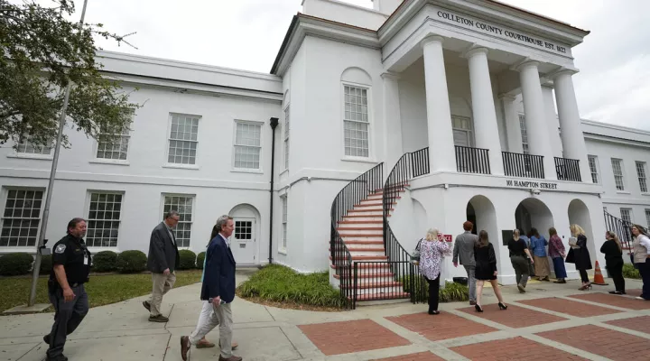 Members of the media and general public gathered outside the Colleton County Courthouse Thursday, March 2, 2023, in Walterboro, S.C. As the double murder trial of Alex Murdaugh wraps, the heaps of public attention poured on the case's many twists and turns. The 54-year-old attorney is standing trial on two counts of murder in the shootings of his wife and son at their Colleton County home and hunting lodge on June 7, 2021. (AP Photo/Chris Carlson)