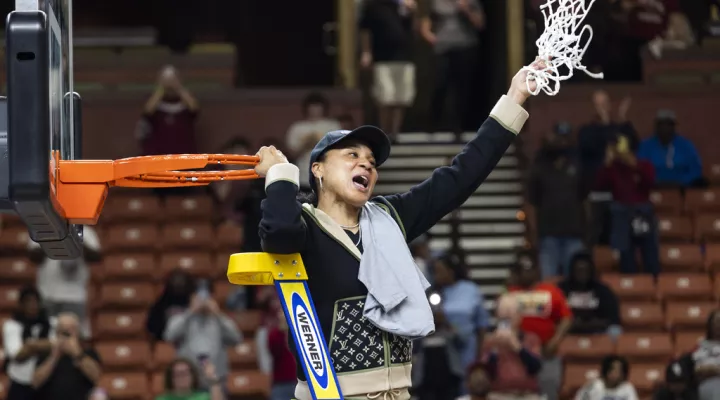 South Carolina head coach Dawn Staley celebrates with the net after defeating Maryland in an Elite 8 college basketball game of the NCAA Tournament in Greenville, S.C., Monday, March 27, 2023. (AP Photo/Mic Smith)