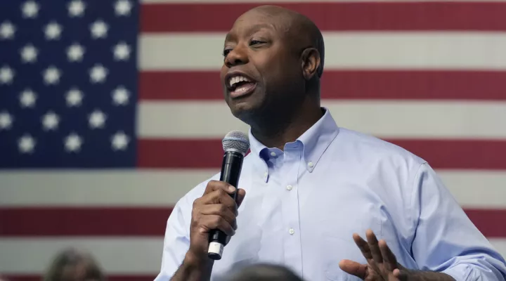 FILE - Sen. Tim Scott, R-S.C., speaks during a town hall, May 8, 2023, in Manchester, N.H. Scott plans to begin airing ads in Iowa and New Hampshire early next week as he prepares for an expected 2024 Republican presidential campaign. The ad buy, valued at about $5.5 million, is scheduled to run through the first GOP presidential debate in late August.(AP Photo/Charles Krupa)