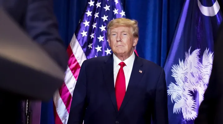 Former President Donald Trump listens as he is introduced to speak at the South Carolina Statehouse, Saturday, Jan. 28, 2023, in Columbia, S.C.