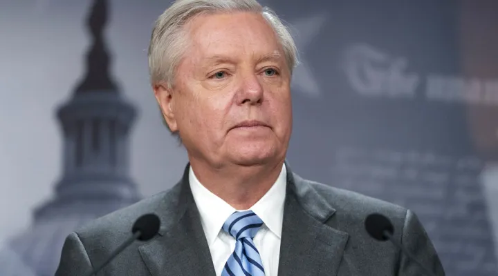 FILE - Sen. Lindsey Graham, R-S.C., speaks with reporters about aid to Ukraine, on Capitol Hill, Wednesday, March 10, 2022, in Washington. Attorneys representing Graham said Wednesday, July 6, that he intends to challenge a subpoena compelling him to testify before a special grand jury in Georgia investigating former President Donald Trump and his allies' actions after the 2020 election. (AP Photo/Alex Brandon, File)