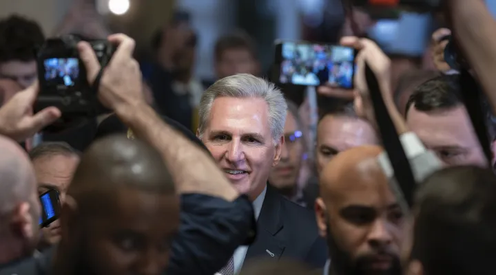 Speaker of the House Kevin McCarthy, R-Calif., is surrounded by press and police on the way to the chamber, at the Capitol in Washington, Tuesday, Oct. 3, 2023. McCarthy’s ability to remain in leadership is now seriously at risk after the House voted to move ahead with an effort by hard-right Republican critics to oust him. Tuesday’s narrow vote was forced by McCarthy’s chief rival, Rep. Matt Gaetz of Florida. (AP Photo/J. Scott Applewhite)