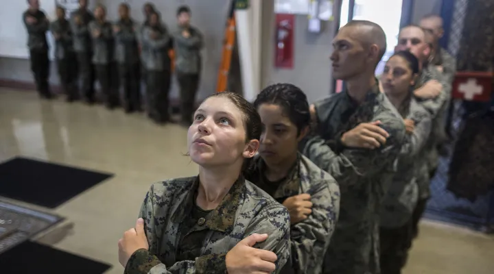 A group of U.S. Marine Corps recruits wait inline before jumping into the water during swim training at the Marine Corps Recruit Depot pool, Wednesday, June 28, 2023, in Parris Island, S.C. (AP Photo/Stephen B. Morton)