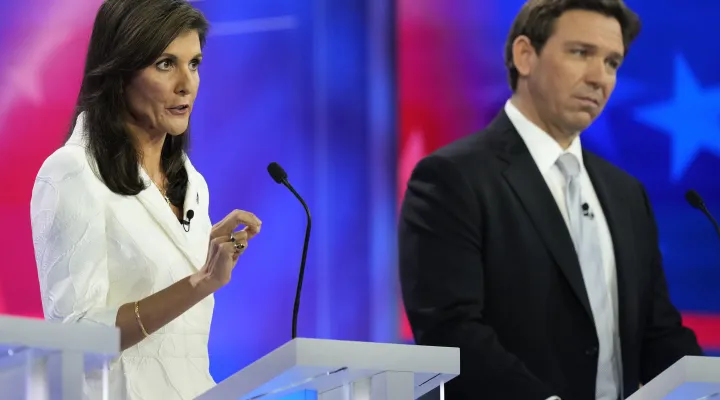 Republican presidential candidate former U.N. Ambassador Nikki Haley speaks as Florida Gov. Ron DeSantis listens during a Republican presidential primary debate hosted by NBC News, Wednesday, Nov. 8, 2023, at the Adrienne Arsht Center for the Performing Arts of Miami-Dade County in Miami. (AP Photo/Rebecca Blackwell)