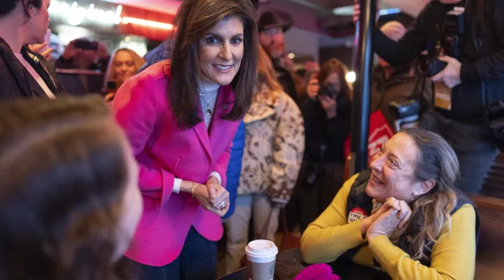 FILE - Republican presidential candidate former UN Ambassador Nikki Haley, center, greets supporters during a campaign event in Des Moines, Iowa, Jan. 15, 2024. Haley has suspended her Republican presidential campaign. The former South Carolina governor ended her White House bid Wednesday, March 6. (AP Photo/Carolyn Kaster)