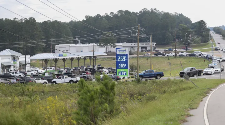 Residents wait in long lines for gas at Parker's Kitchen in the aftermath of Hurricane Helene Sunday, Sept. 29, 2024, in Aiken, S.C. (AP Photo/Artie Walker Jr.)