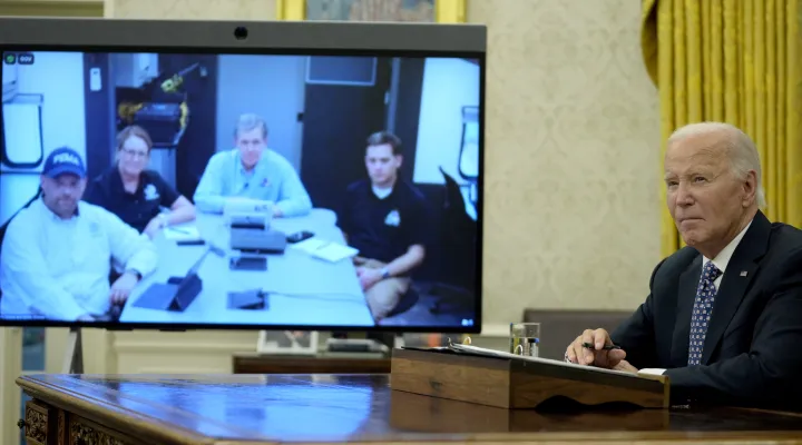 President Joe Biden, right, speaks with North Carolina Gov. Roy Cooper, on screen at center right, and Administrator of the U.S. Federal Emergency Management Agency Deanne Criswell, onscreen at center left, about the Biden administration's efforts to aid in recovery from the aftermath of Hurricane Helene from the Oval Office of the White House in Washington, Monday, Sept. 30, 2024. (AP Photo/Mark Schiefelbein)