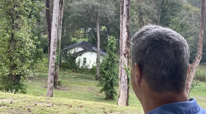 These days, Edward Phillips tends to look past this house on Huckleberry Creek in Cheraw. The house in this photo used to be Phillips' dream retirement home. But when floodwaters washed him and his wife out, the couple took a buyout and moved up to the top of the bluff. He's still wistful for what might have been.