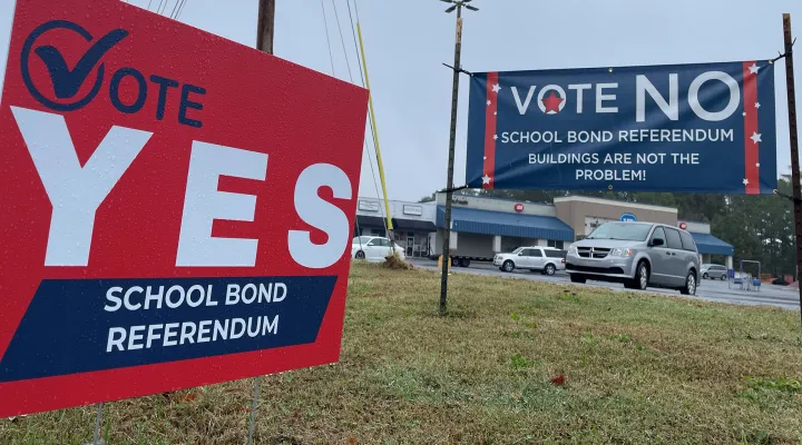 Voters in three counties saw dueling signs regarding their school district's proposed bond referendums. They split on which to approve and which to deny.