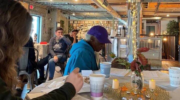 The quiet before the feast. The Speak Up! Magazine writer's group ponders things they're thankful for, before coming together for a meal at the Mercantile in Rock Hill Tuesday.