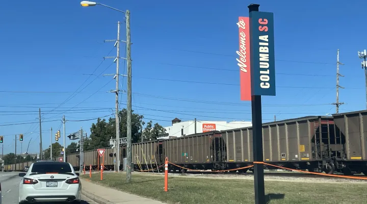 A train blocks traffic on Assembly Street in Columbia, South Carolina.