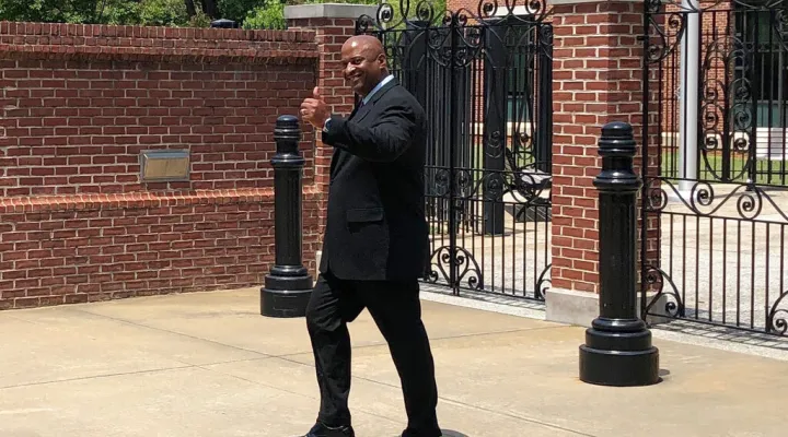 FILE - In this Tuesday, May 21, 2019, file photo, suspended Chester County Sheriff Alex Underwood gives a thumbs-up as he walks out of the federal courthouse in Columbia, S.C. (AP Photo/Jeffrey Collins, File)