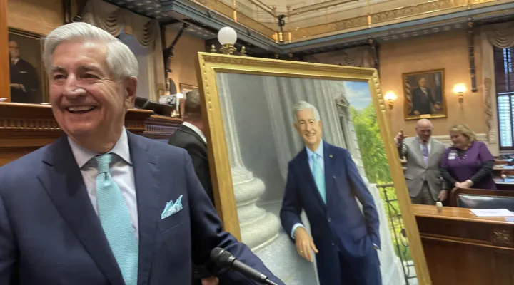 Former S.C. Sen. Nikki Setzler, D-Lexington, stands next to his Senate portrait unveiled Wednesday, Jan. 22, 2025, in the Statehouse Senate chambers in Columbia, S.C.