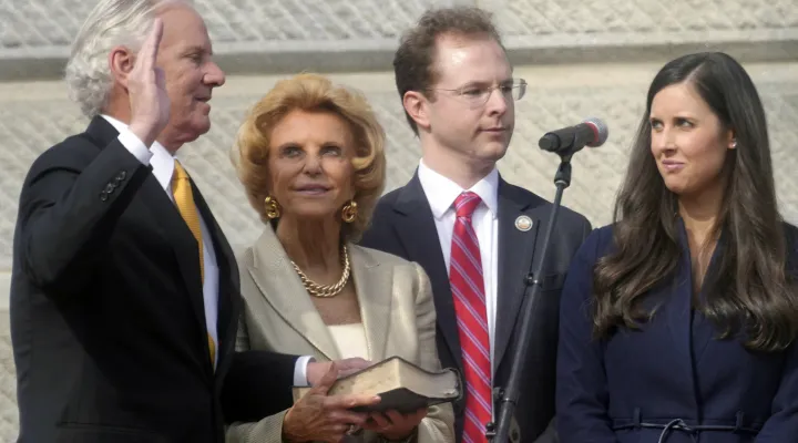 South Carolina Gov. Henry McMaster, left, takes the oath of office as his wife, Peggy McMaster, and other family members look on at his second inaugural on Wednesday, Jan. 11, 2023, in Columbia, S.C. (AP Photo/Meg Kinnard)