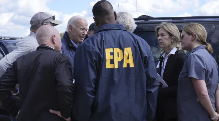 President Joe Biden talks with local and federal officials, as he arrives at Greenville-Spartanburg International Airport in Greer, S.C., Wednesday, Oct. 2, 2024, to survey damage from Hurricane Helene. (AP Photo/Susan Walsh)