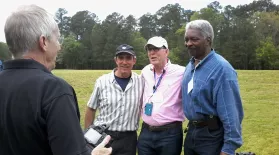 Dr. Walter Edgar poses for a picture with several ETV employees: Steve Folks, Arthur Joseph, and William Richardson