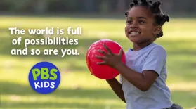 image of a young child outside holding a ball