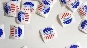 photo of several "I voted" stickers on a white tabletop