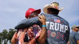  Couple waits for former President Donald Trump to speak at campaign appearance at Sportsman Boats in Summerville, S.C. Sept. 25, 2023.